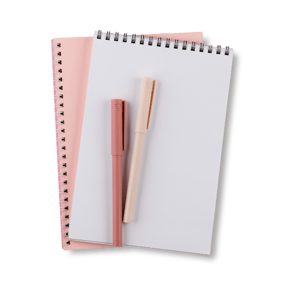 Two spirals notebooks with two pens on top